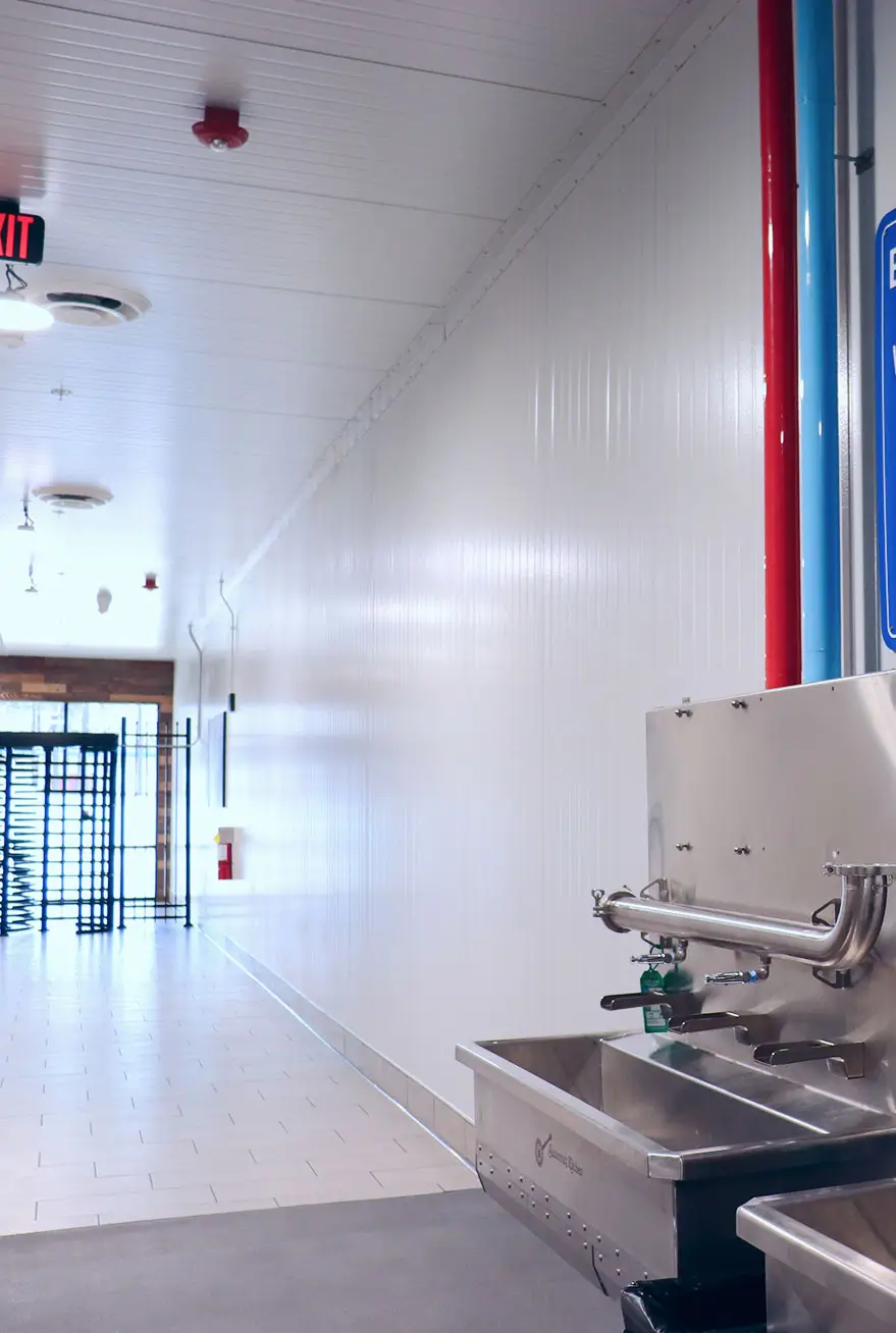 Insulated metal panels for food processing facility walls