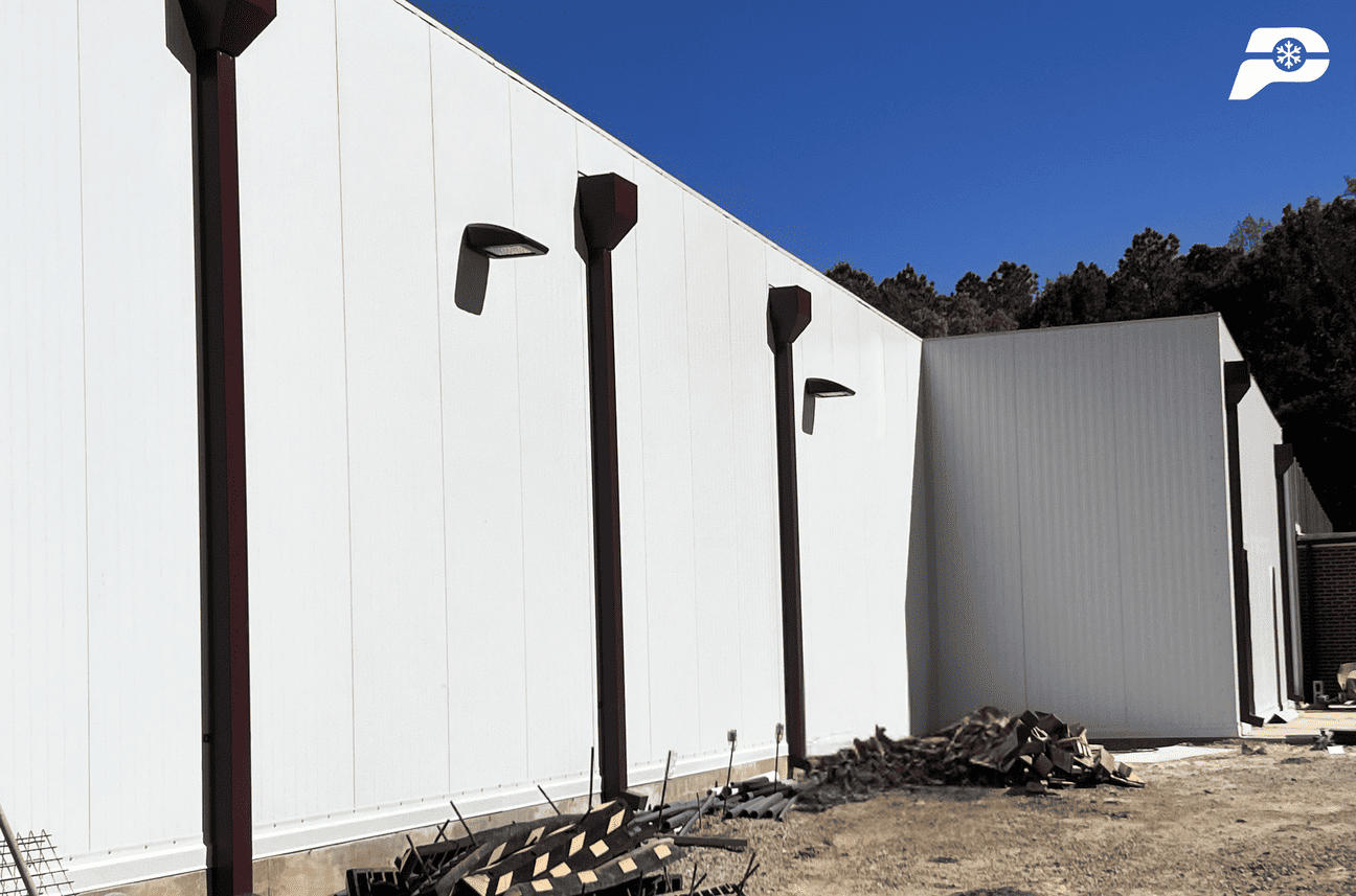 Exterior view of a climate-controlled facility constructed with insulated metal panels for cold storage and industrial applications.